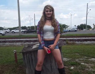 Horny school gal frolicking snatch in public, right near the