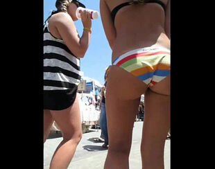Lovely maiden dolls in bathing suit in a public place.