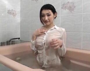 Take a bathtub while wearing a t-shirt