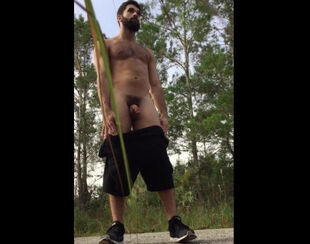 Bearded queer displays his pound slot outdoor