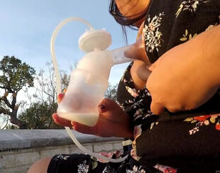 Trampy mummy splattering milk from juggs in public place